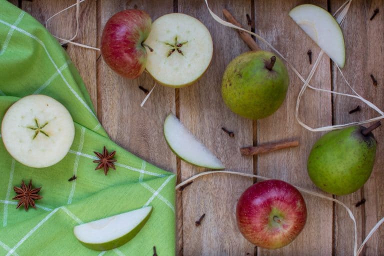 Cut apples on wooden table